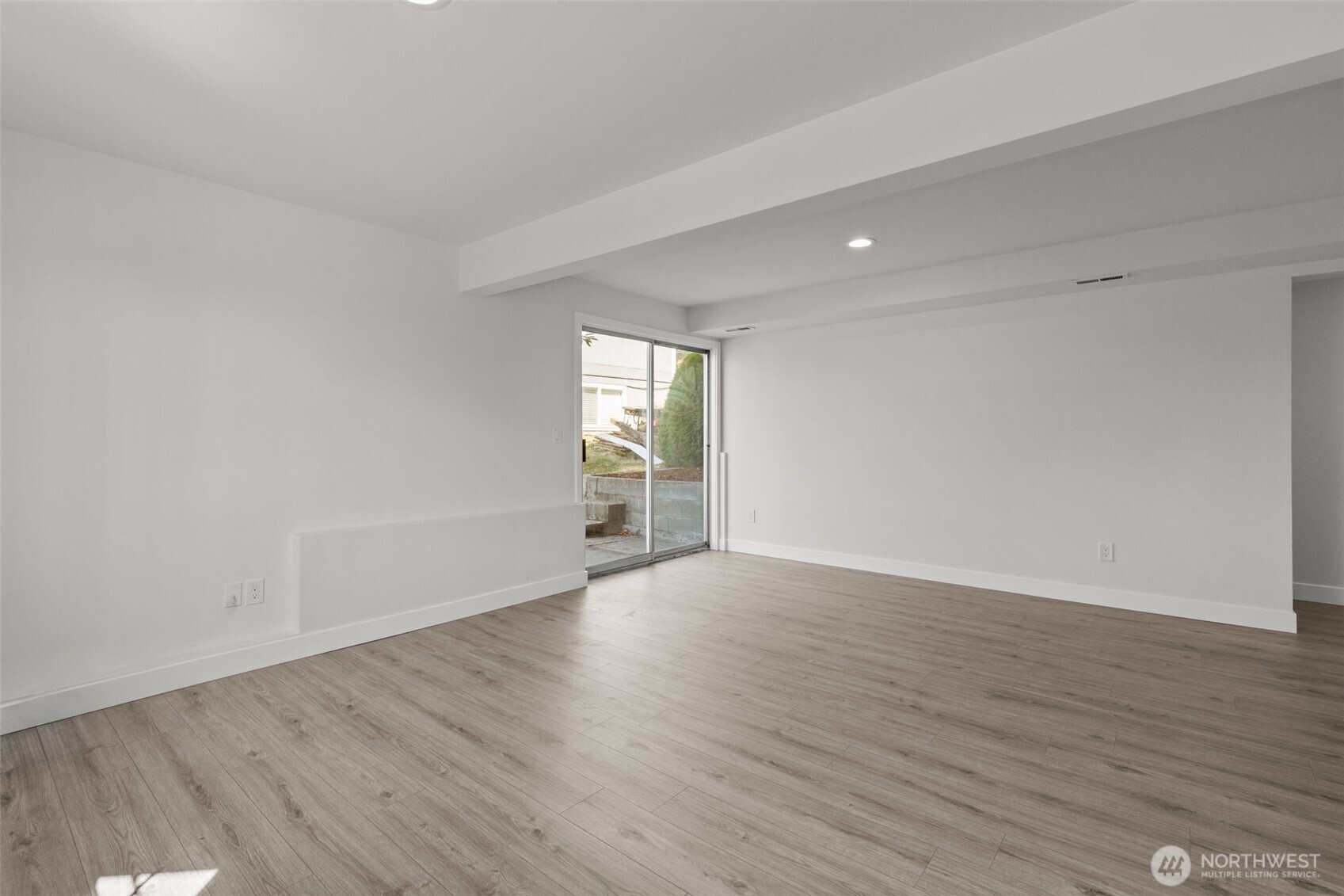 11822 56th Place South Seattle, WA 98178 - Photo 32 of 39 a view of an empty room with wooden floor and a window
