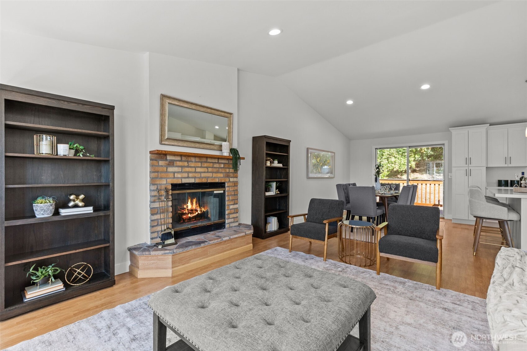 11822 56th Place South Seattle, WA 98178 - Photo 4 of 39 a living room with furniture a flat screen tv and a fireplace