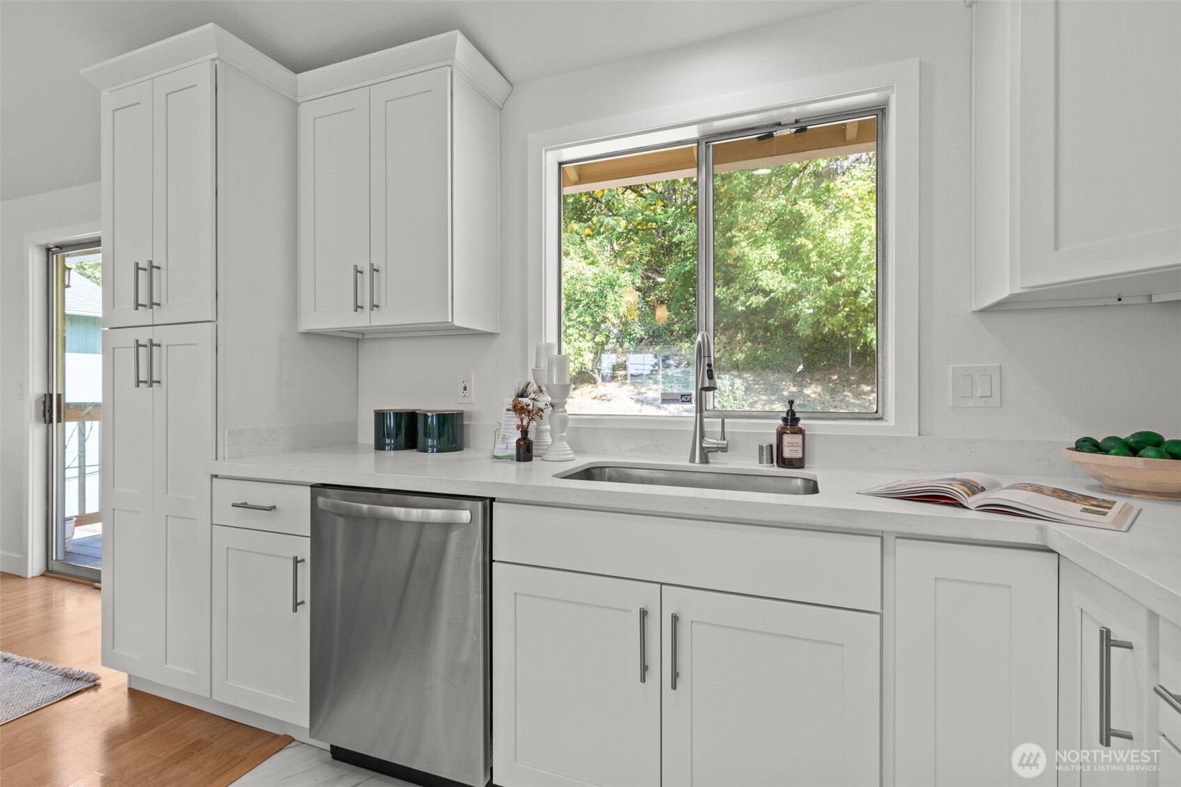 11822 56th Place South Seattle, WA 98178 - Photo 10 of 39 a kitchen with white cabinets and a window