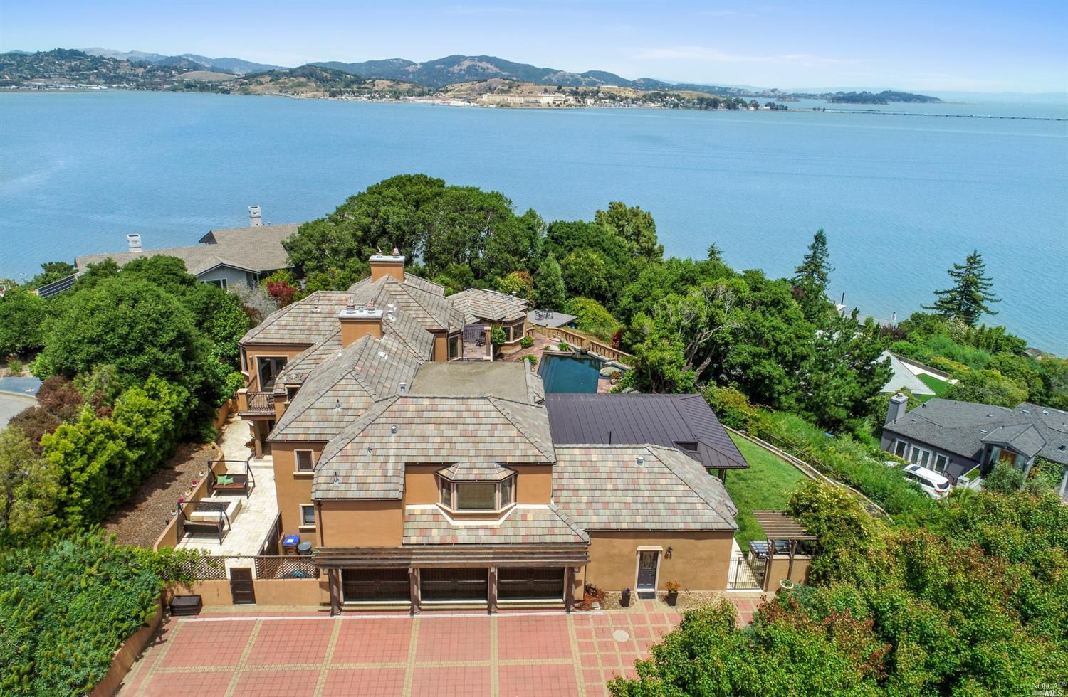 an aerial view of a house with a lake view