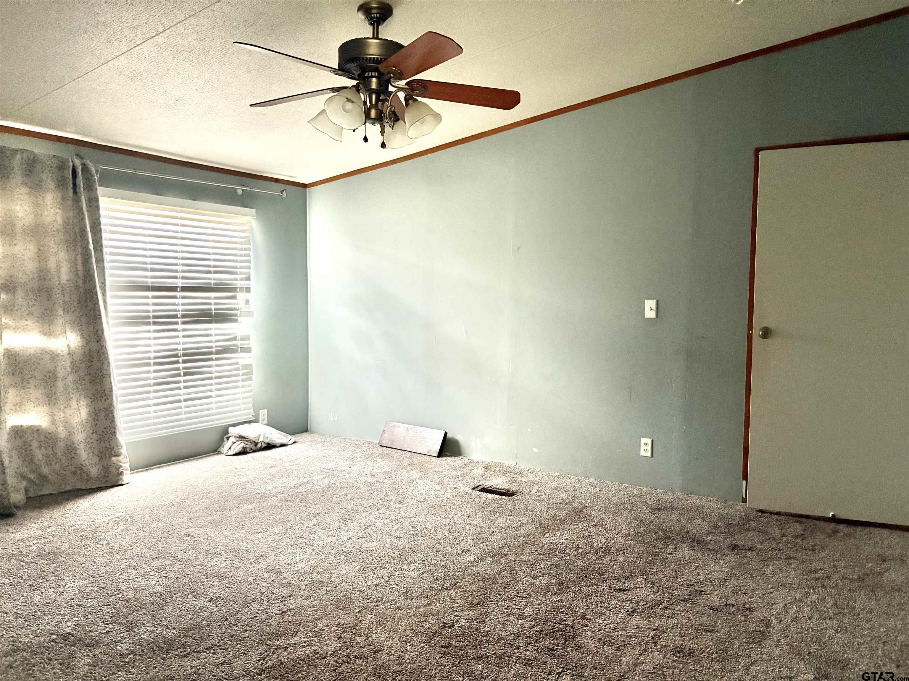 310 Cr 4231 Mount Mount Pleasant, TX 75455 - Photo 11 of 19 a view of an empty room with a window