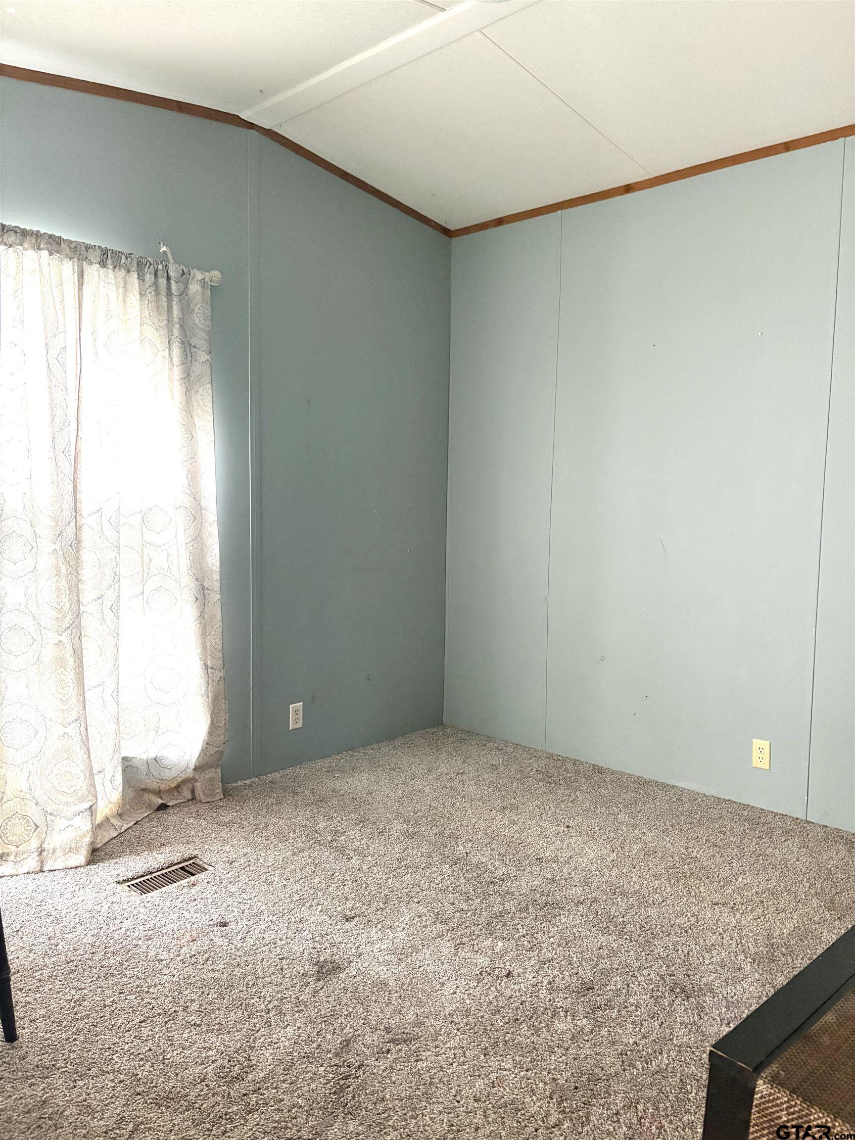 310 Cr 4231 Mount Mount Pleasant, TX 75455 - Photo 12 of 19 an empty room with a empty space and a window