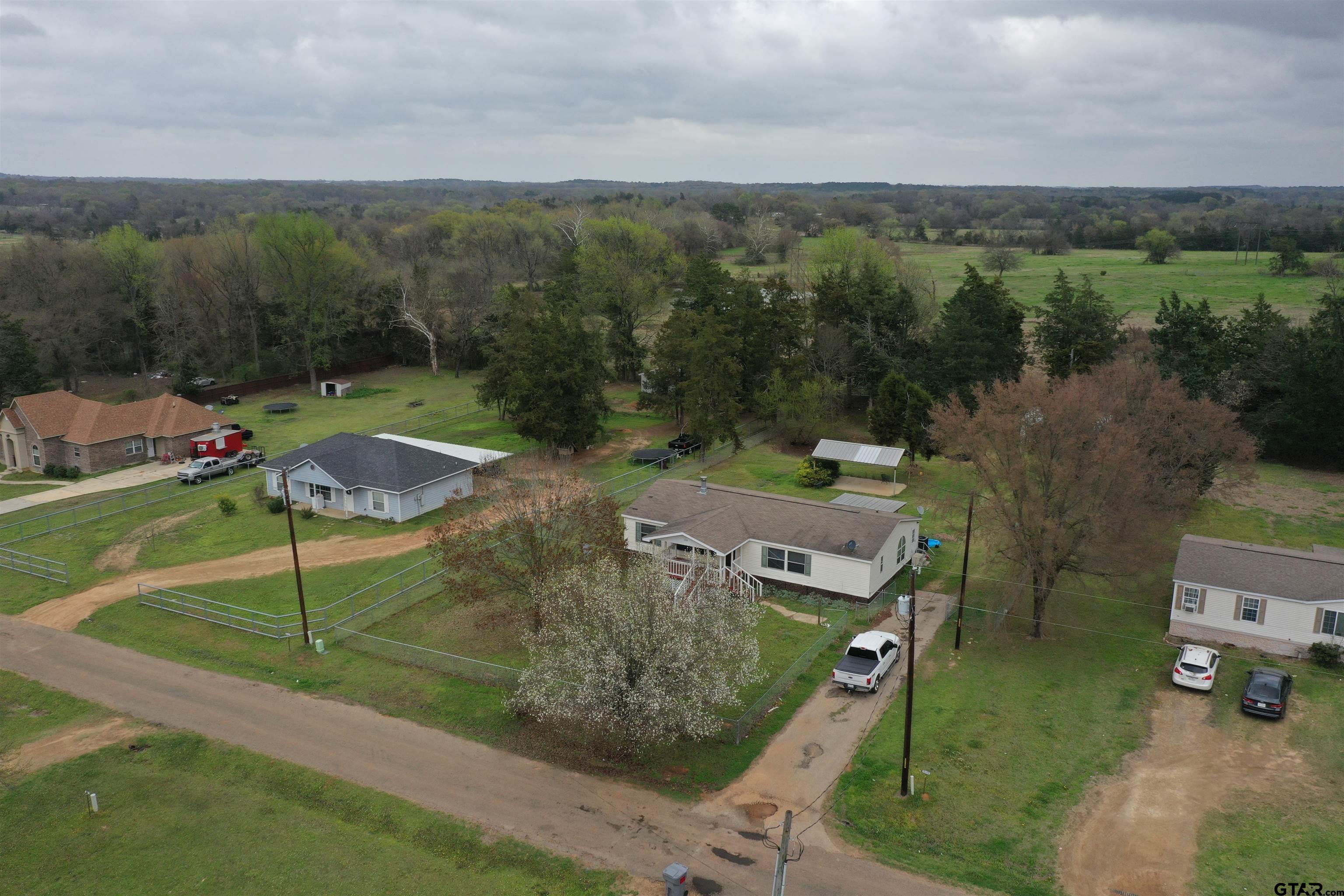 310 Cr 4231 Mount Mount Pleasant, TX 75455 - Photo 3 of 19 an aerial view of a house with a garden