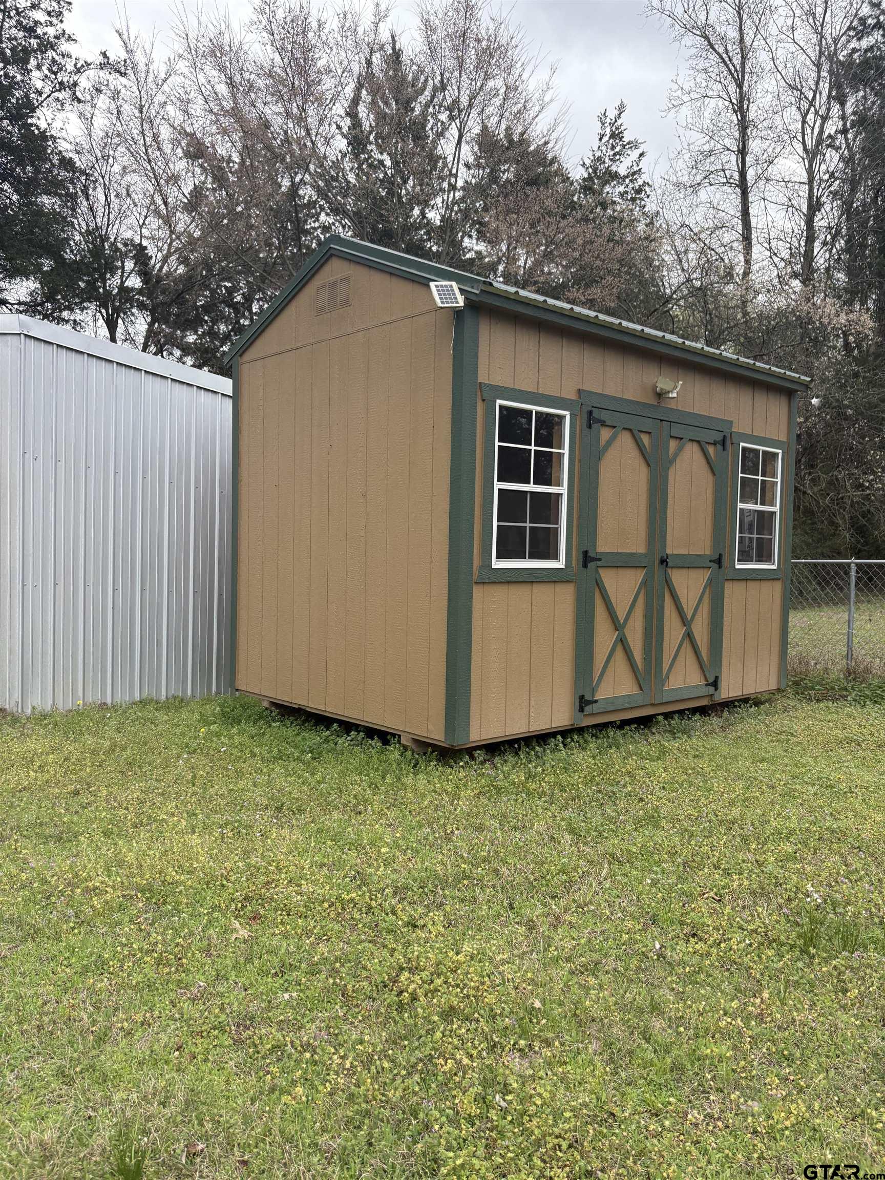310 Cr 4231 Mount Mount Pleasant, TX 75455 - Photo 5 of 19 a house with trees in the background