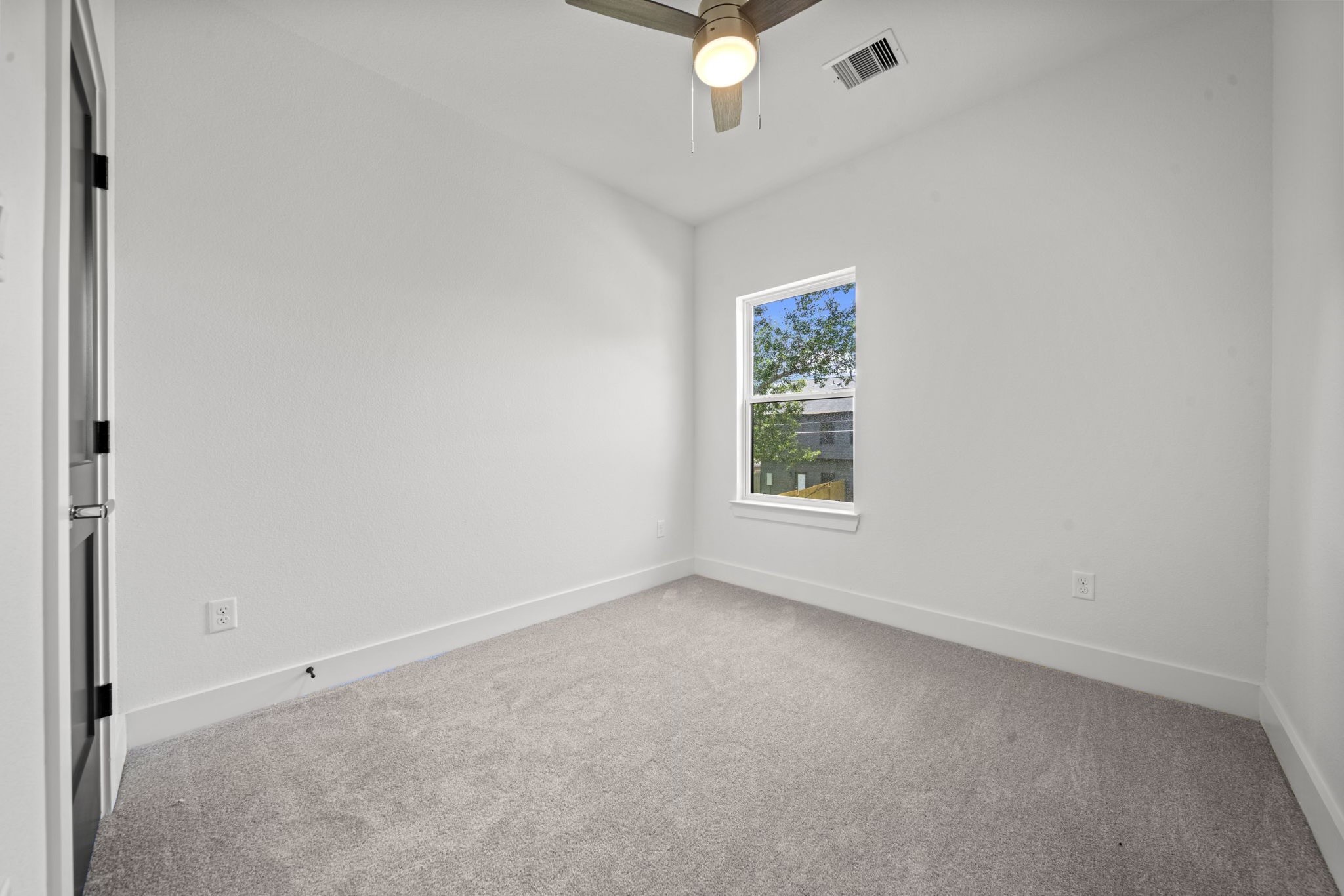4930 Chennault Road, Unit A Houston, TX 77033 - Photo 12 of 16 an empty room with windows