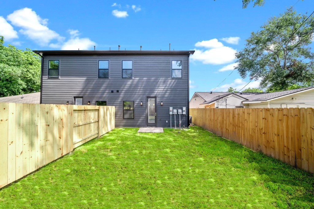 4930 Chennault Road, Unit A Houston, TX 77033 - Photo 16 of 16 a backyard of a house with lots of green space