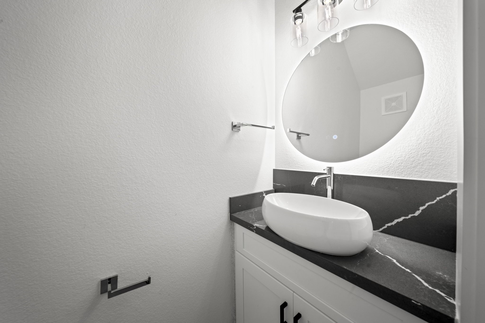 4930 Chennault Road, Unit A Houston, TX 77033 - Photo 4 of 16 a bathroom with a granite countertop sink and mirror