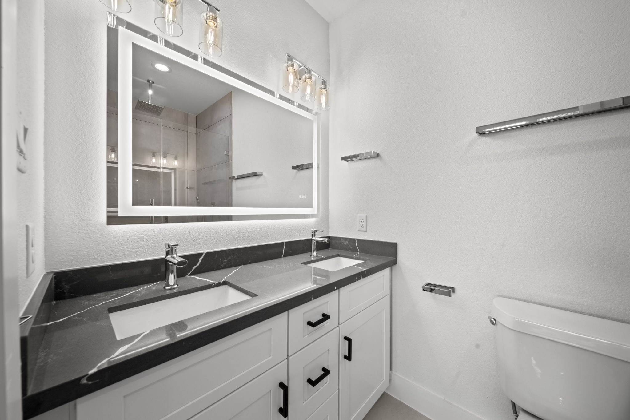 4930 Chennault Road, Unit A Houston, TX 77033 - Photo 9 of 16 a bathroom with a sink and a mirror