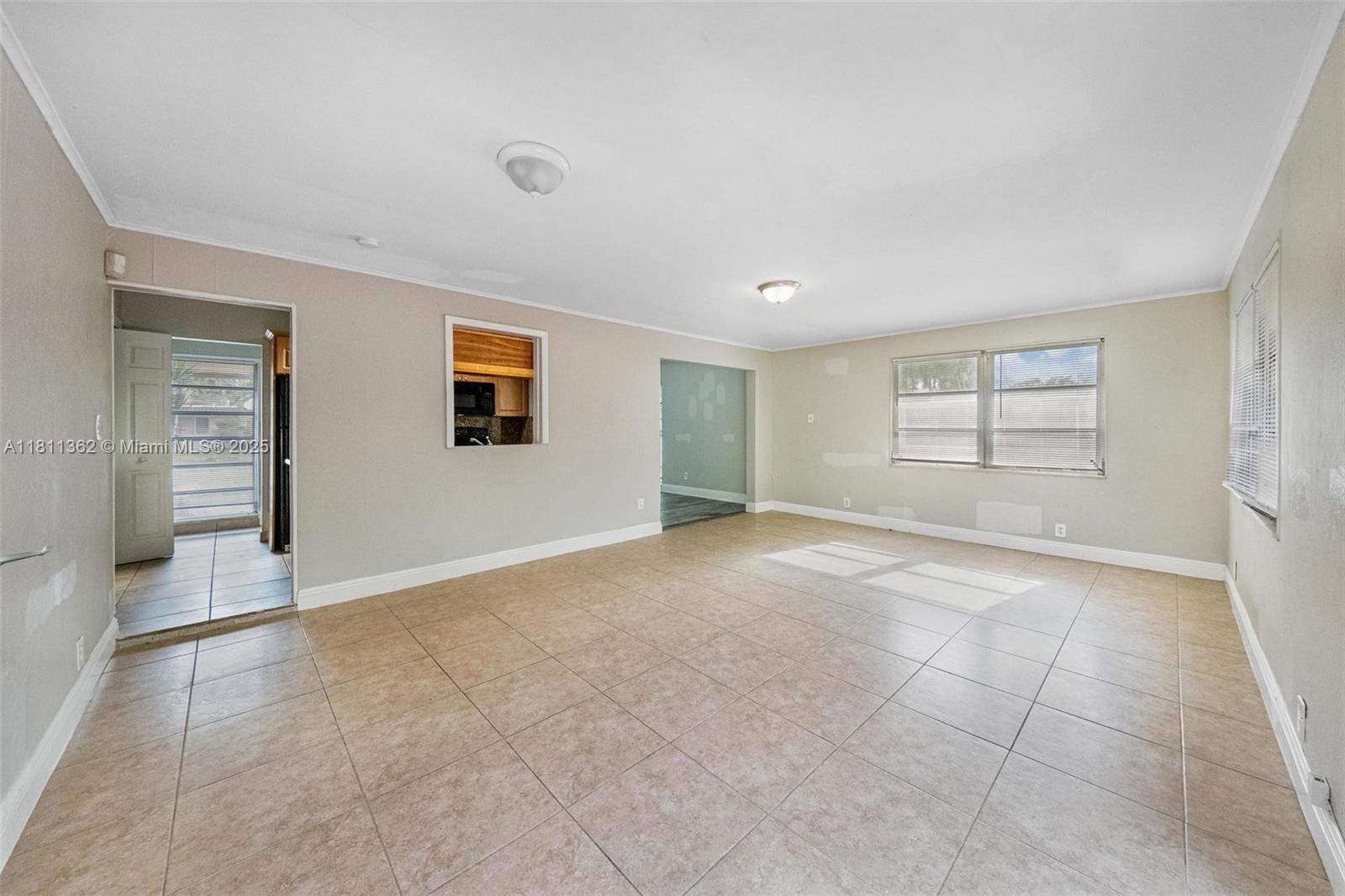 7019 Northwest 63rd Street Tamarac, FL 33321 - Photo 24 of 33 a view of an empty room with a window