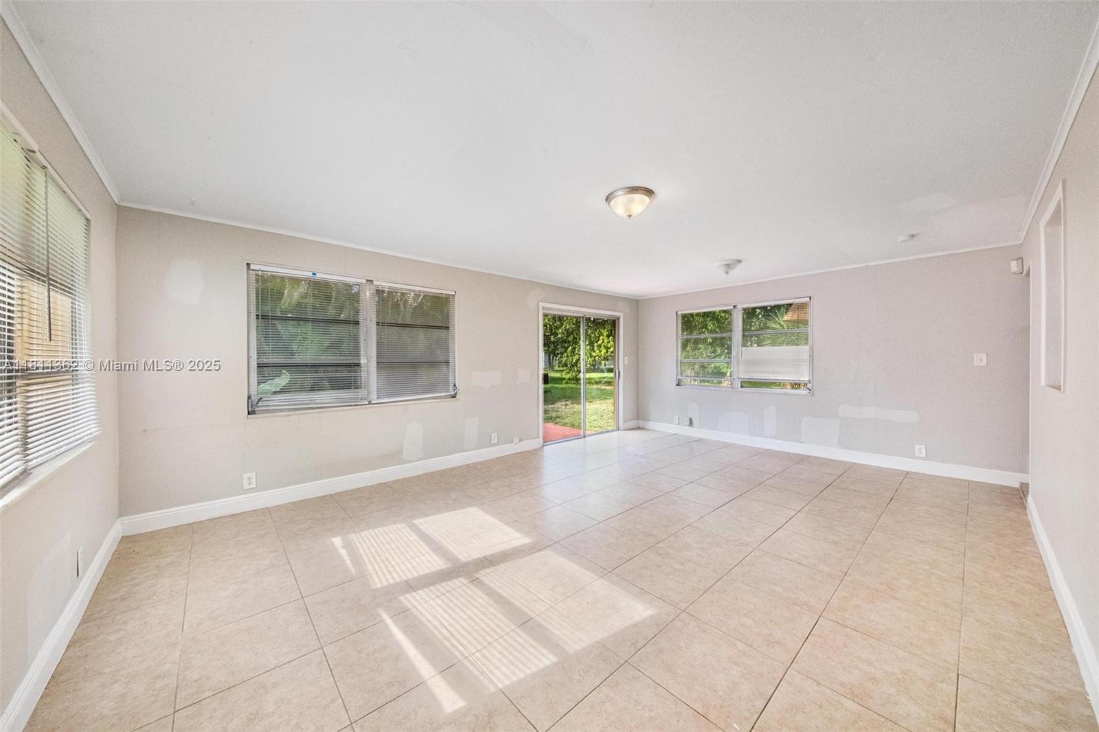 7019 Northwest 63rd Street Tamarac, FL 33321 - Photo 6 of 33 a view of an empty room with a window