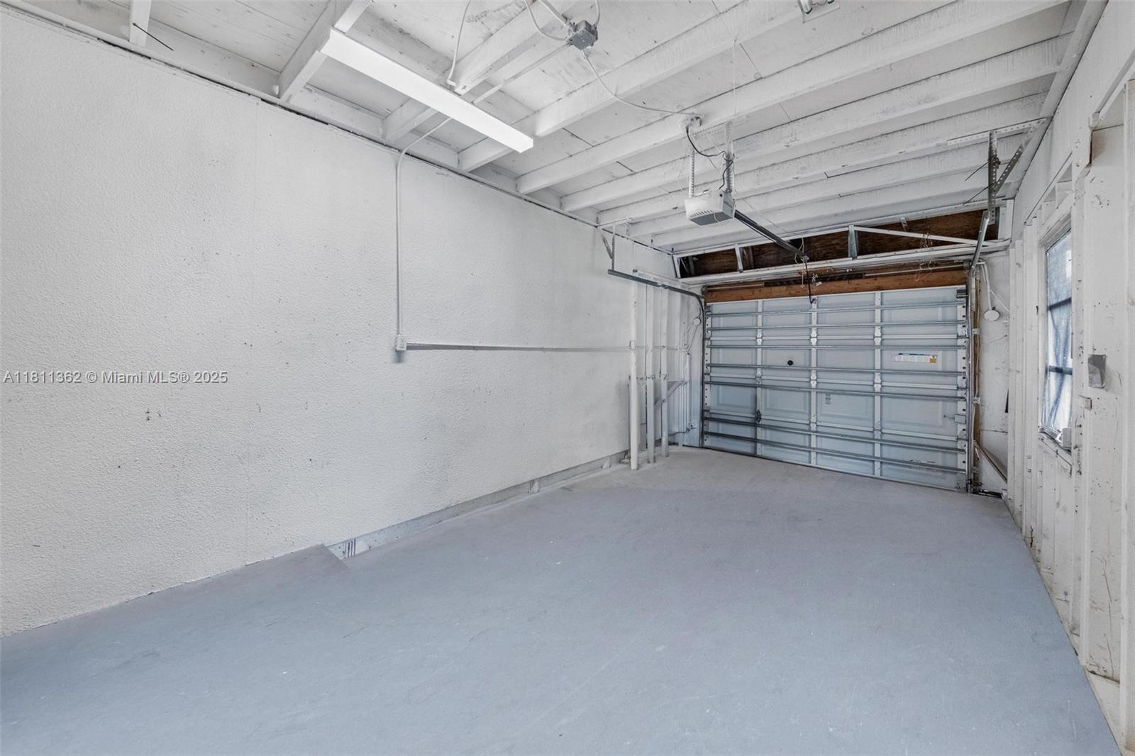 7019 Northwest 63rd Street Tamarac, FL 33321 - Photo 8 of 33 a view of room that has a large window