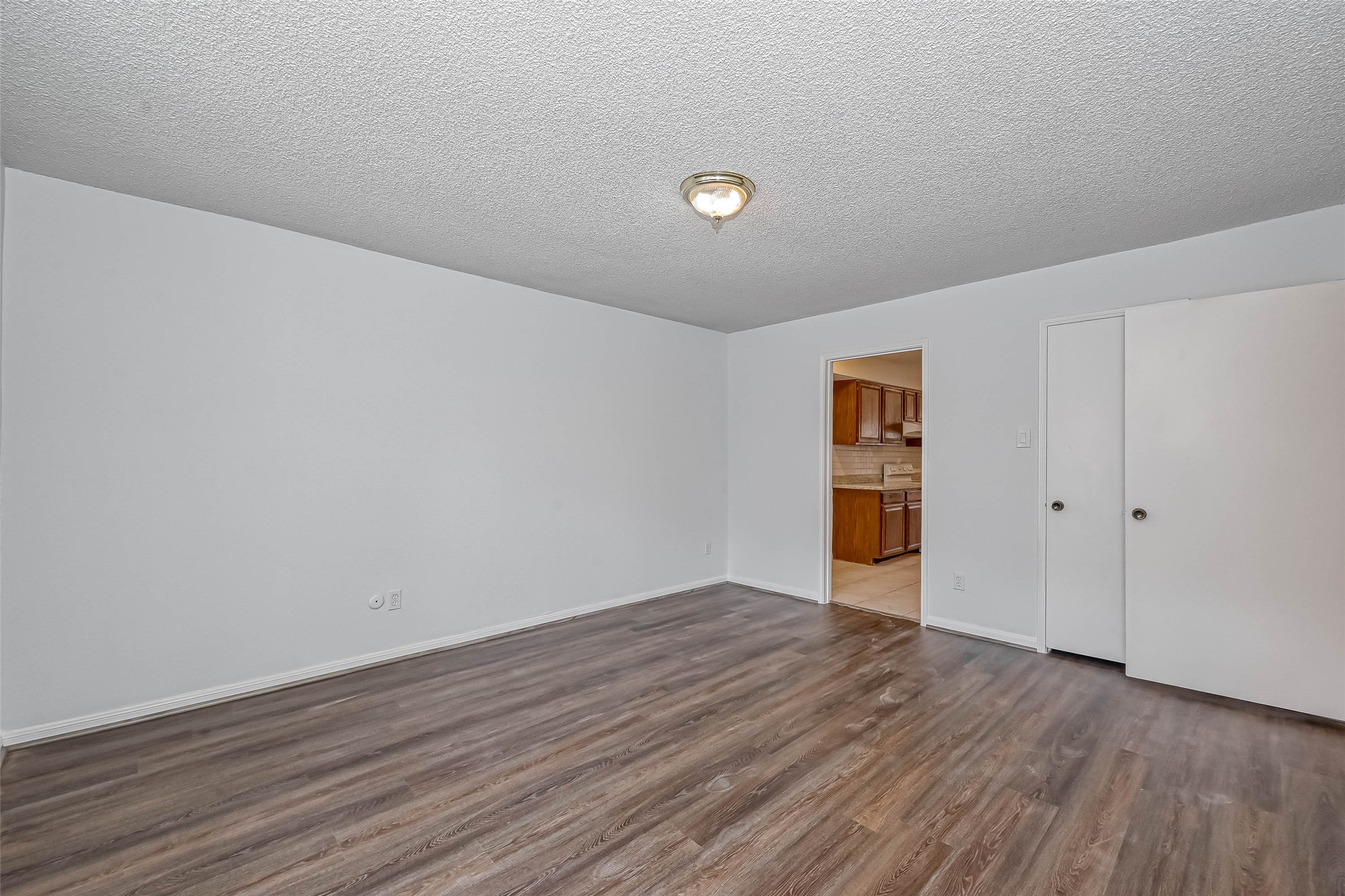 14179 Misty Meadow Lane Houston, TX 77079 - Photo 25 of 41 a view of an empty room with wooden floor