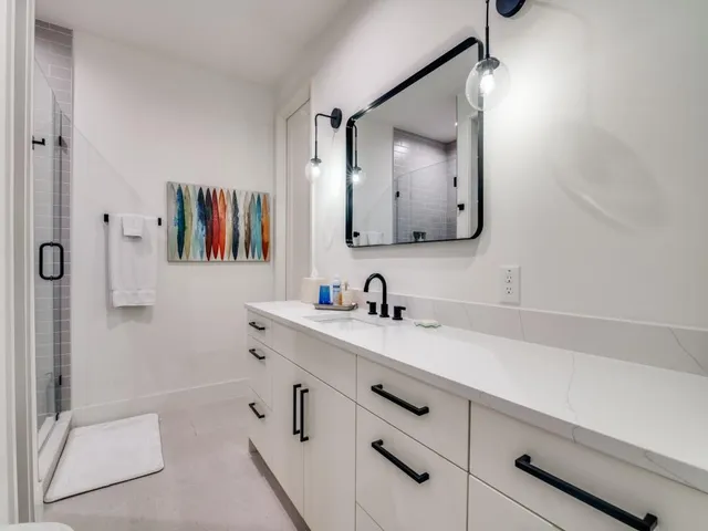 a bathroom with a sink vanity and a mirror