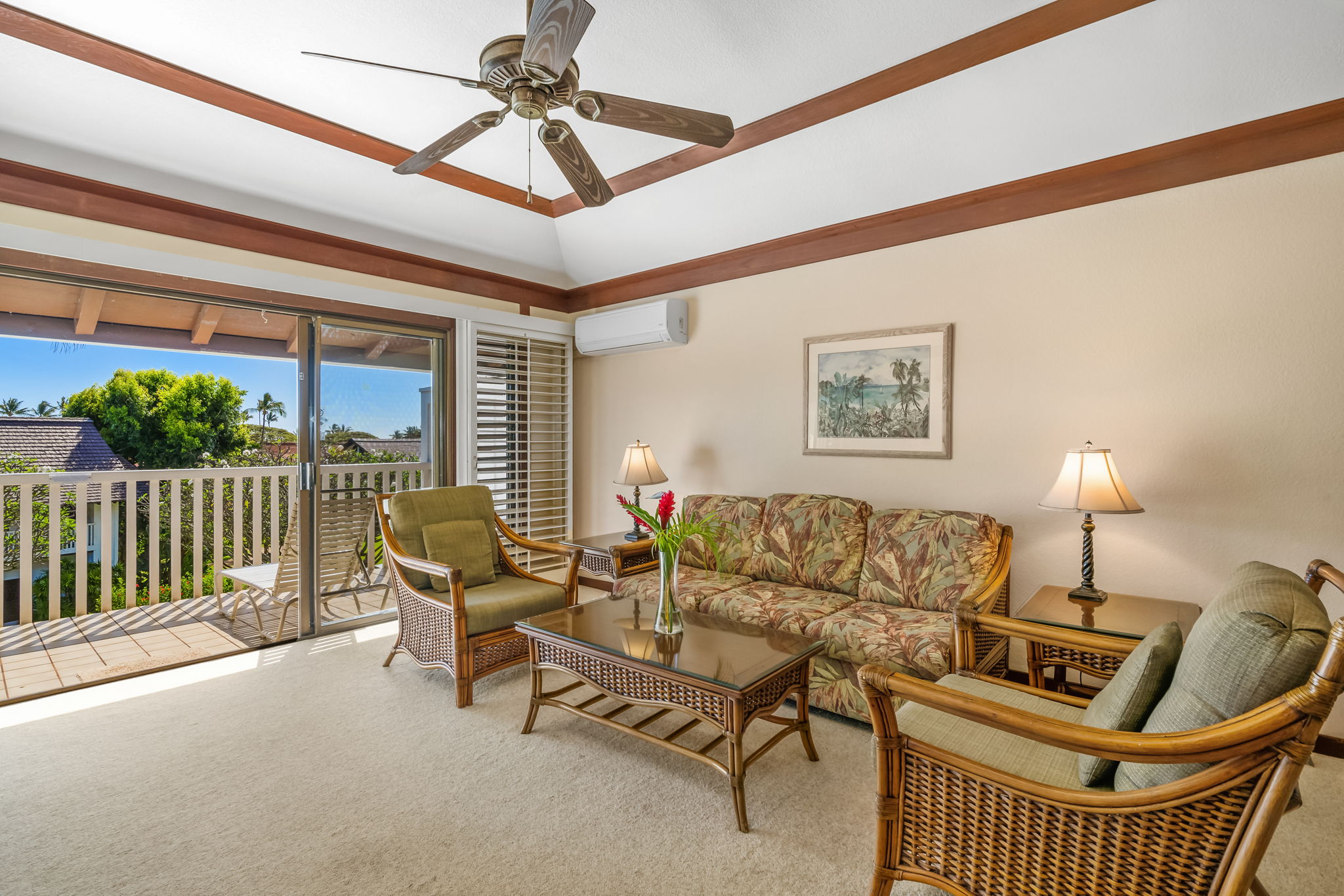 2253 Poipu Road, Unit 109 Koloa, HI 96756 - Photo 6 of 12 a living room with furniture and a floor to ceiling window