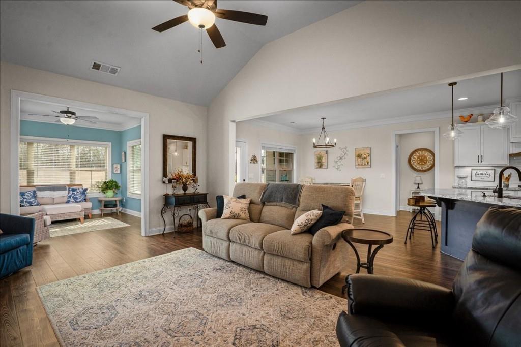 641 Haven Way Monroe, GA 30655 - Photo 17 of 55 a living room with furniture and a chandelier