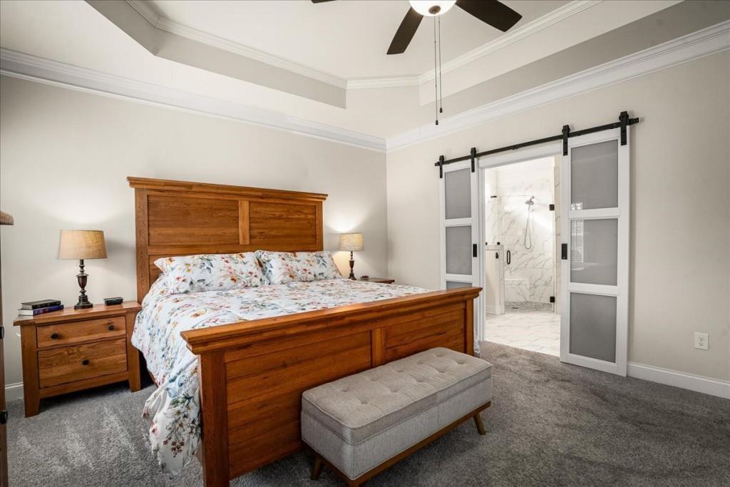 641 Haven Way Monroe, GA 30655 - Photo 24 of 55 a bed room with a bed and a couch