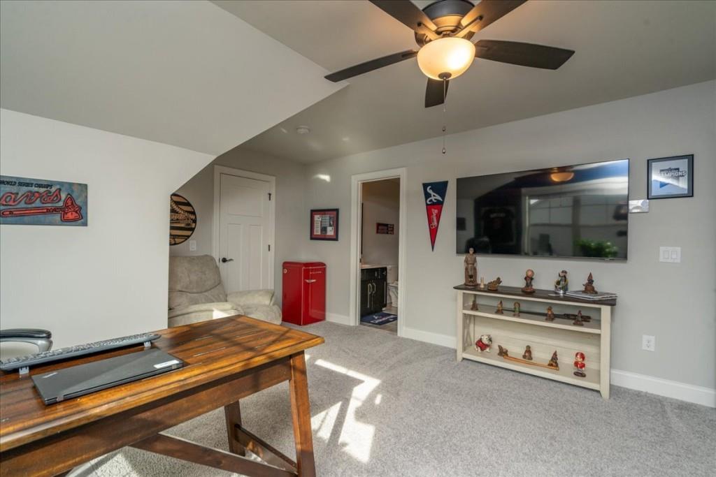 641 Haven Way Monroe, GA 30655 - Photo 34 of 55 a living room with furniture and a flat screen tv