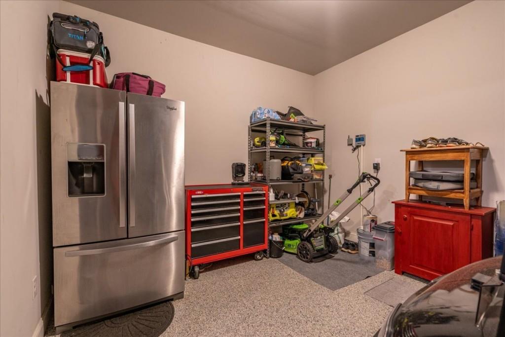 641 Haven Way Monroe, GA 30655 - Photo 38 of 55 a view of a livingroom with furniture and a refrigerator