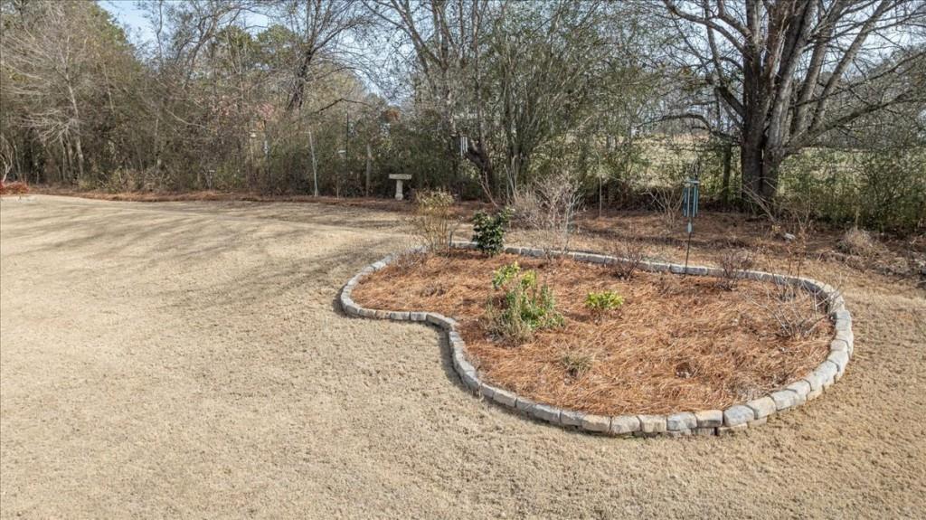 641 Haven Way Monroe, GA 30655 - Photo 41 of 55 a view of a backyard with large trees