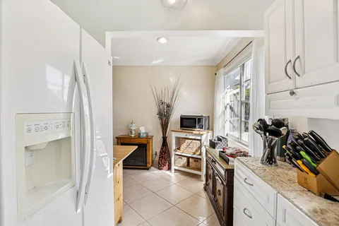 a bathroom with a sink toilet a mirror and shower curtain