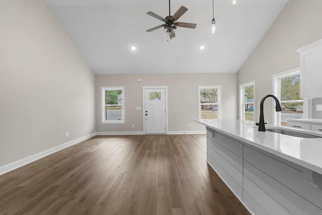 wooden floor in an empty room with a window