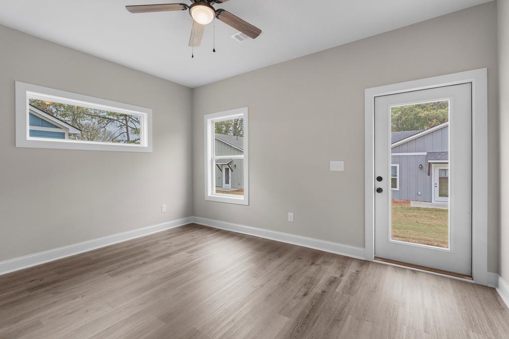 400 Burns Avenue Pine Mountain, GA 31822 - Photo 13 of 16 a view of an empty room with a window and wooden floor