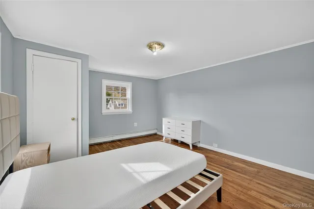 a bedroom with a bed and a lamp on the table