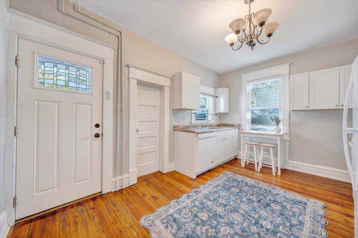 1008 5th Street Southeast Roanoke, VA 24013 - Photo 19 of 60 a kitchen with a stove a sink and a refrigerator