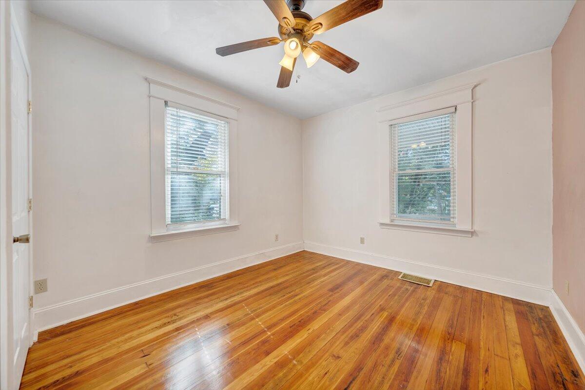 1008 5th Street Southeast Roanoke, VA 24013 - Photo 21 of 60 a view of empty room with wooden floor and fan