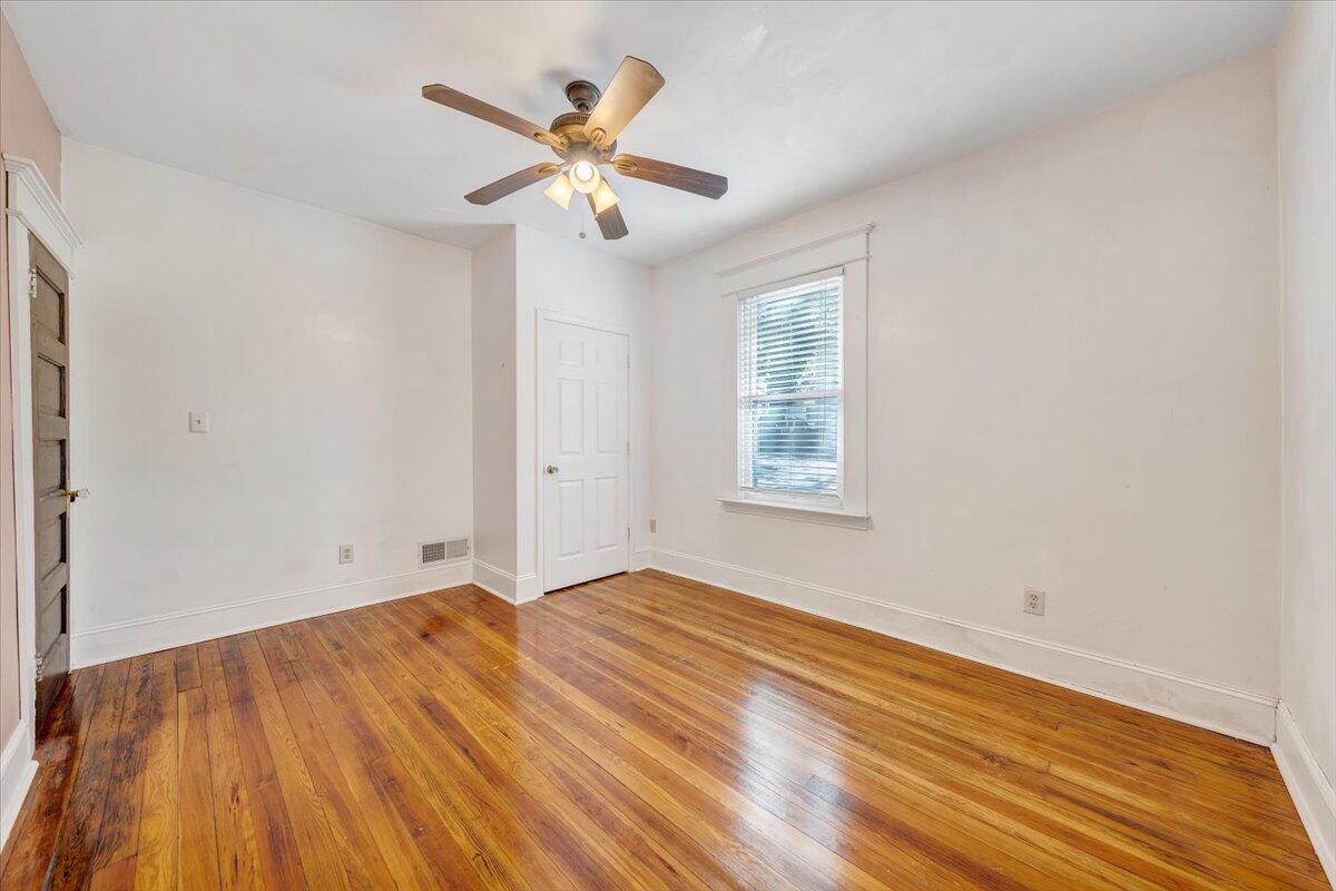1008 5th Street Southeast Roanoke, VA 24013 - Photo 22 of 60 an empty room with wooden floor and windows
