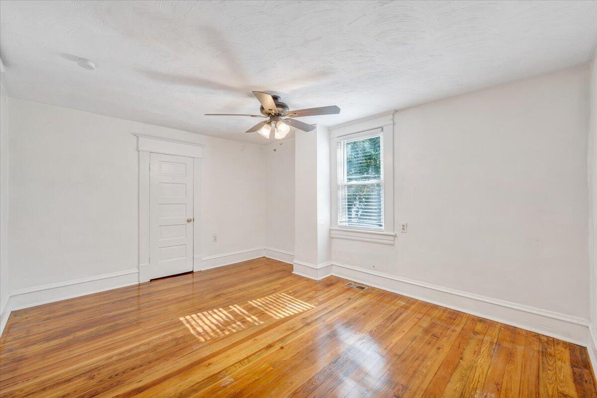 1008 5th Street Southeast Roanoke, VA 24013 - Photo 25 of 60 a view of a room with wooden floor and ceiling fan