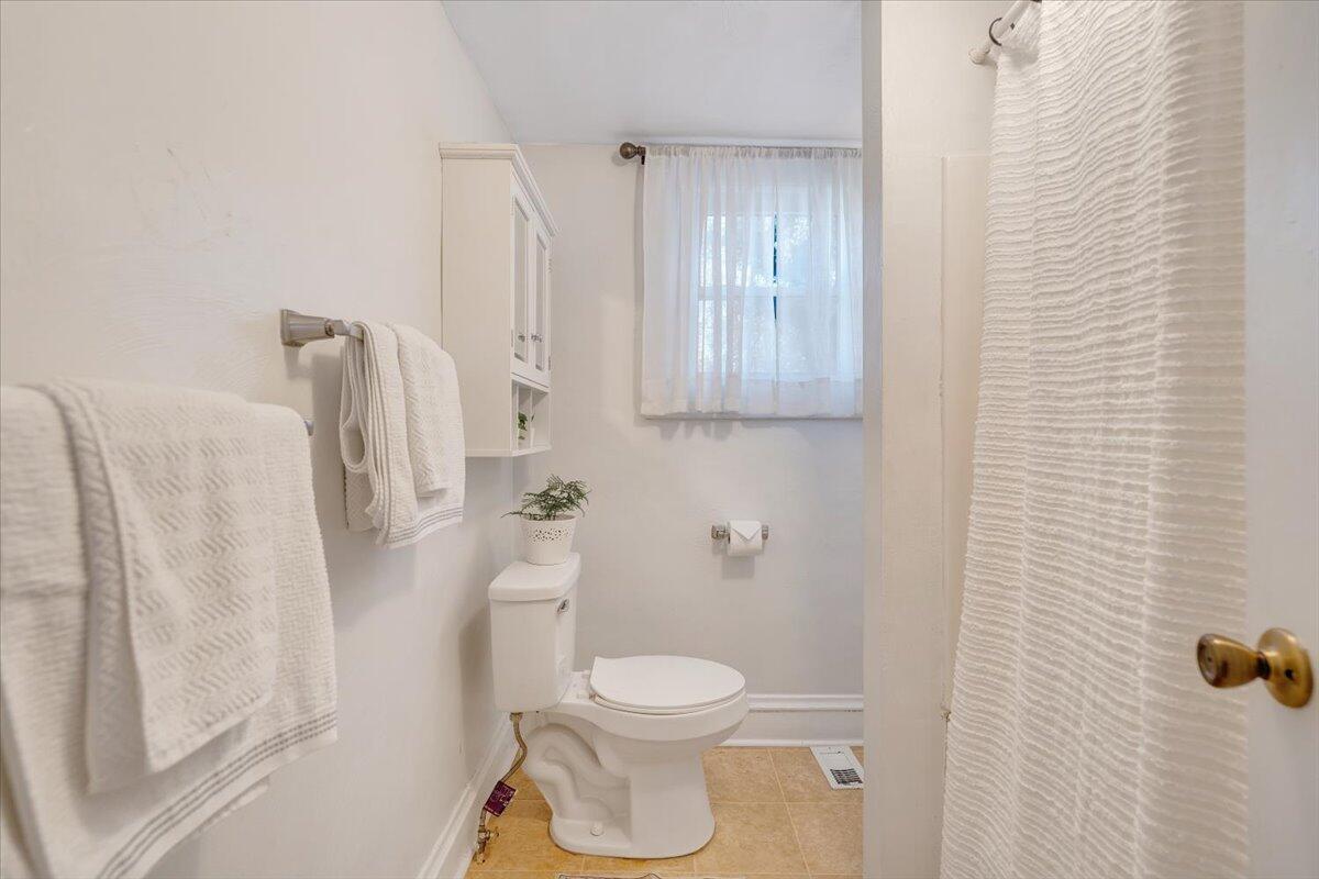 1008 5th Street Southeast Roanoke, VA 24013 - Photo 28 of 60 a white toilet sitting next to a bathroom sink