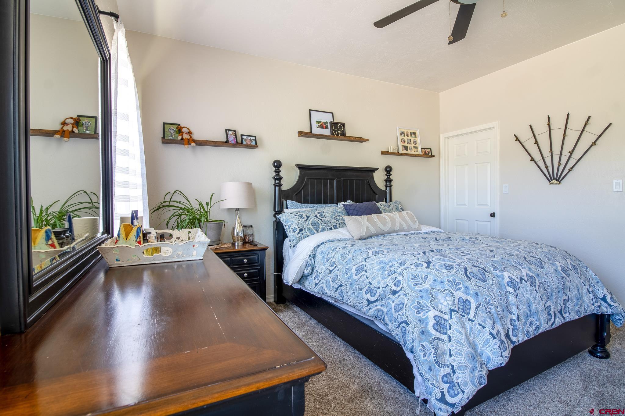 42168 Rd J Mancos, CO 81328 - Photo 12 of 30 a bedroom with a bed and a large window