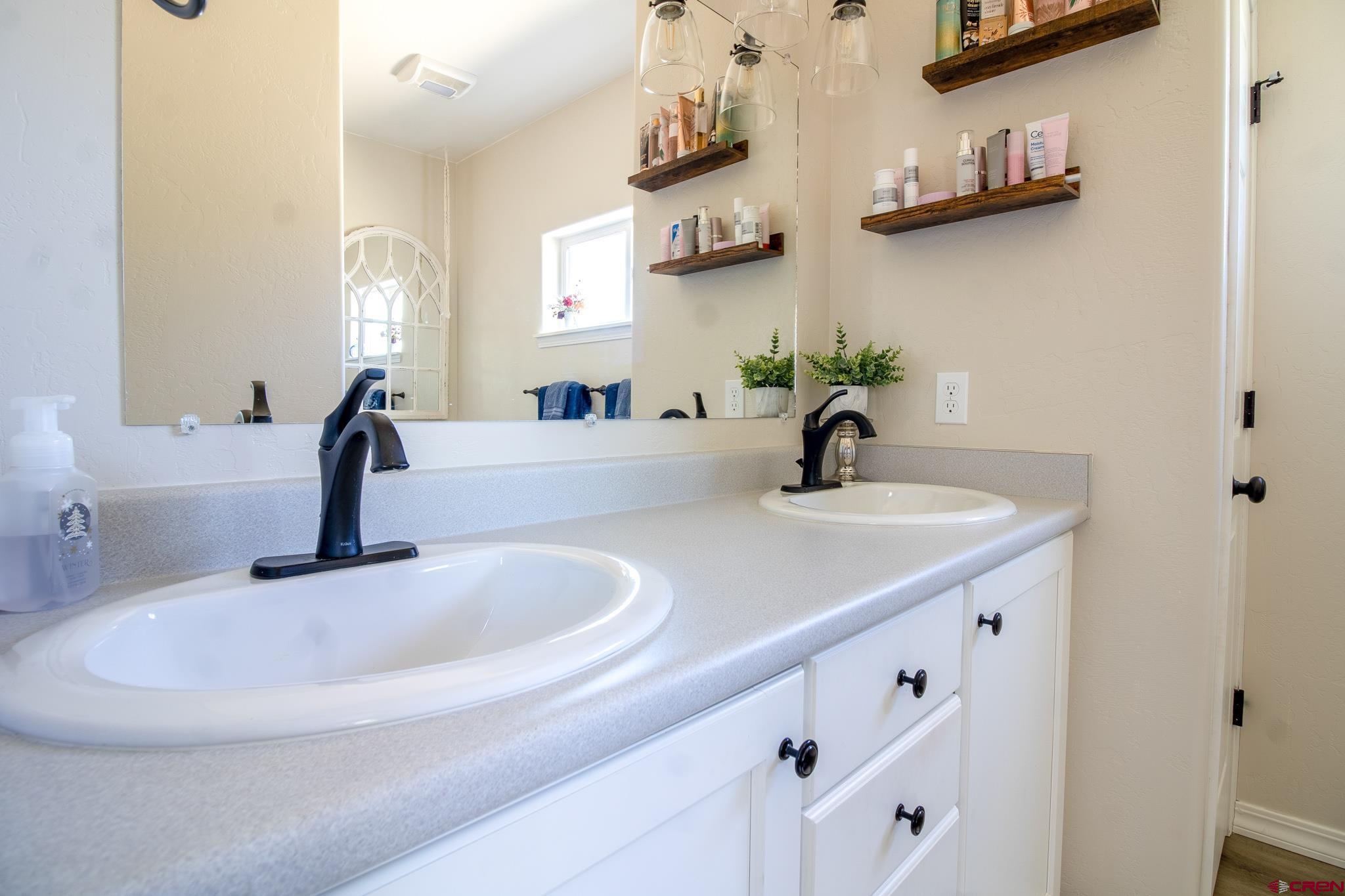 42168 Rd J Mancos, CO 81328 - Photo 14 of 30 a bathroom with a sink and a mirror