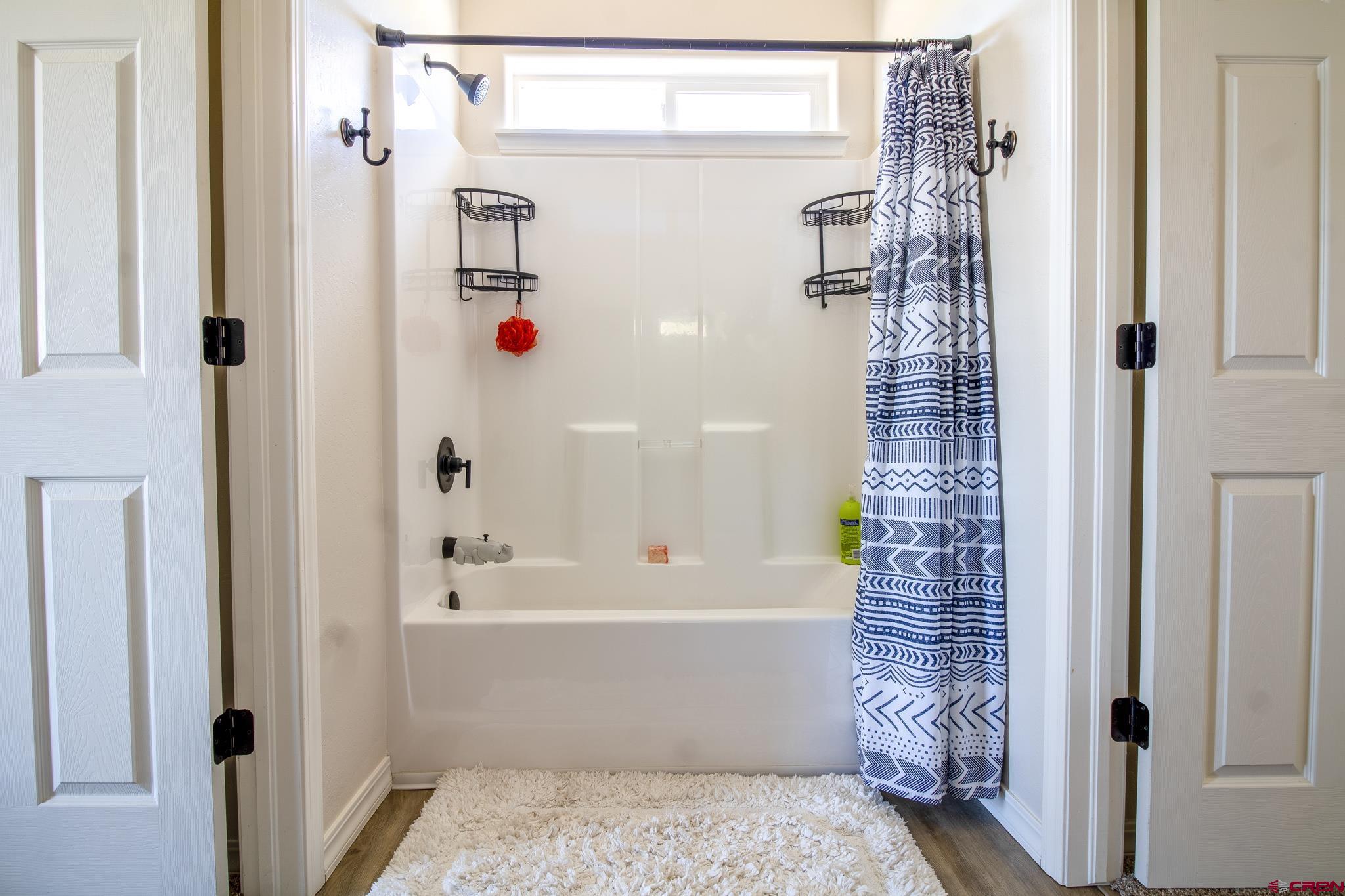 42168 Rd J Mancos, CO 81328 - Photo 19 of 30 a bathroom with a shower