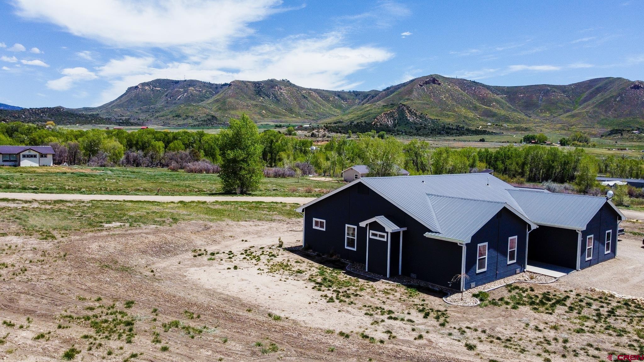 42168 Rd J Mancos, CO 81328 - Photo 2 of 30 a view of a house with a yard
