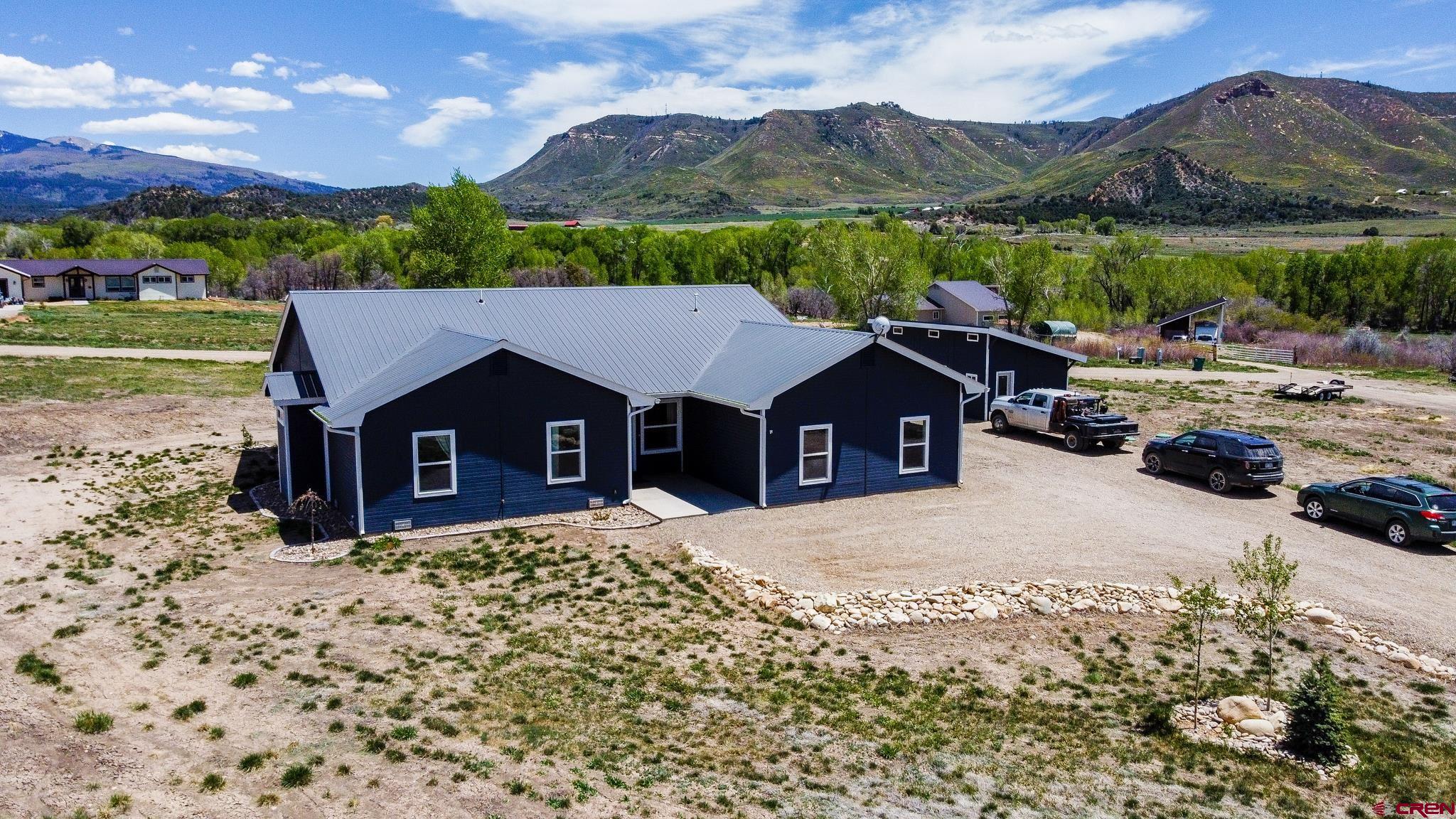 42168 Rd J Mancos, CO 81328 - Photo 23 of 30 a view of a house with a yard