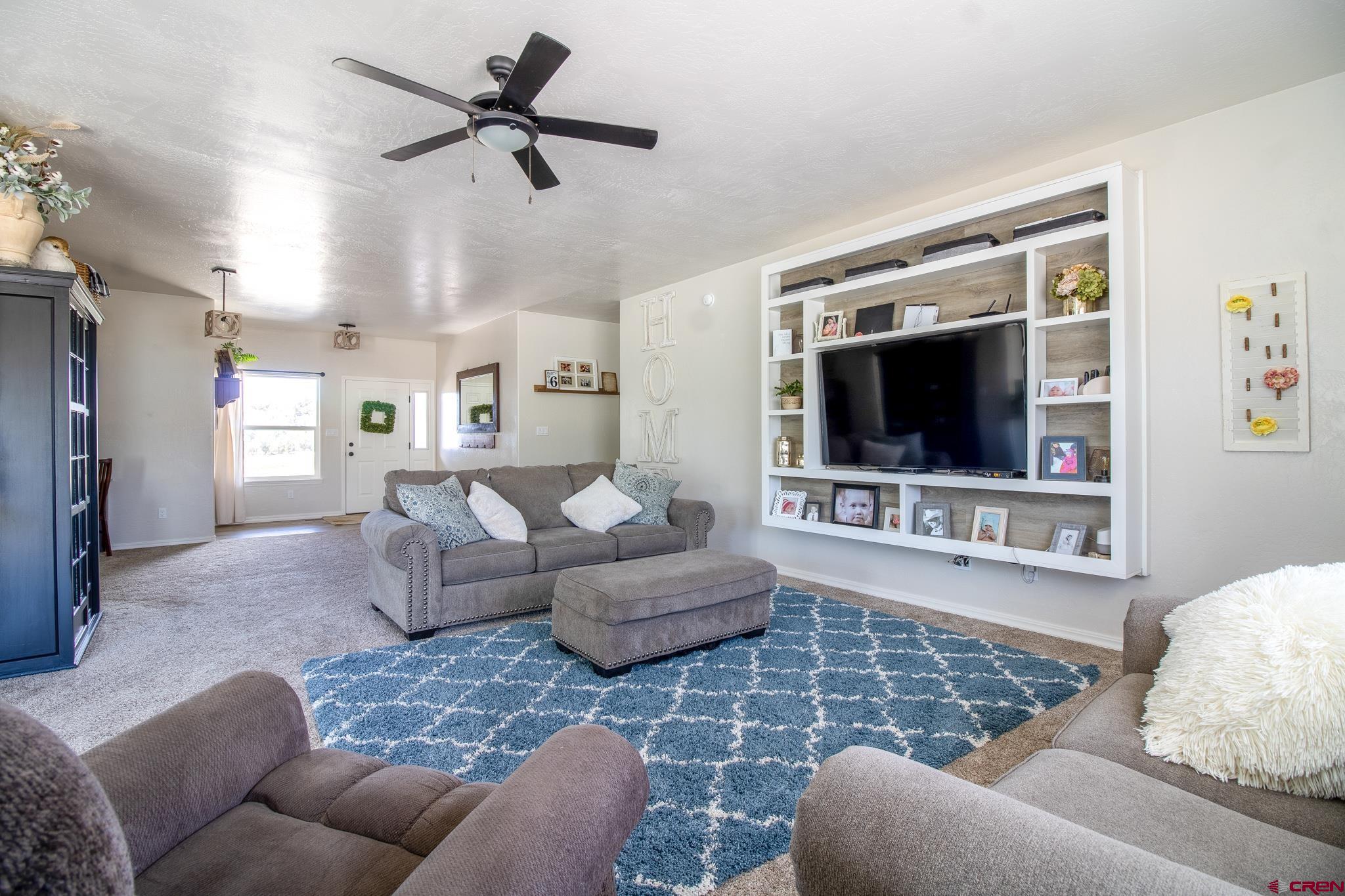 42168 Rd J Mancos, CO 81328 - Photo 4 of 30 a living room with furniture and a flat screen tv