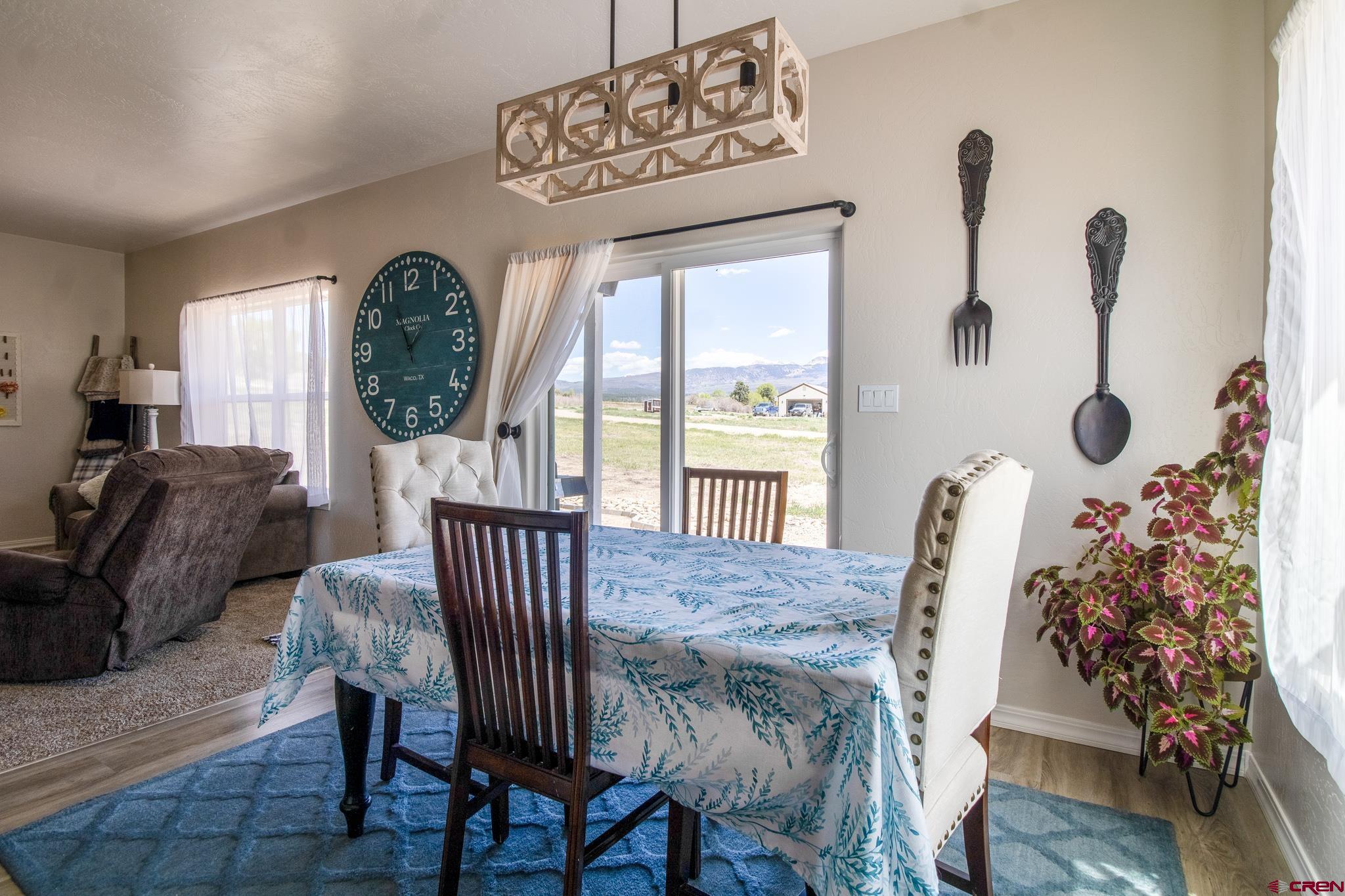 42168 Rd J Mancos, CO 81328 - Photo 8 of 30 a view of a livingroom with furniture window and wooden floor