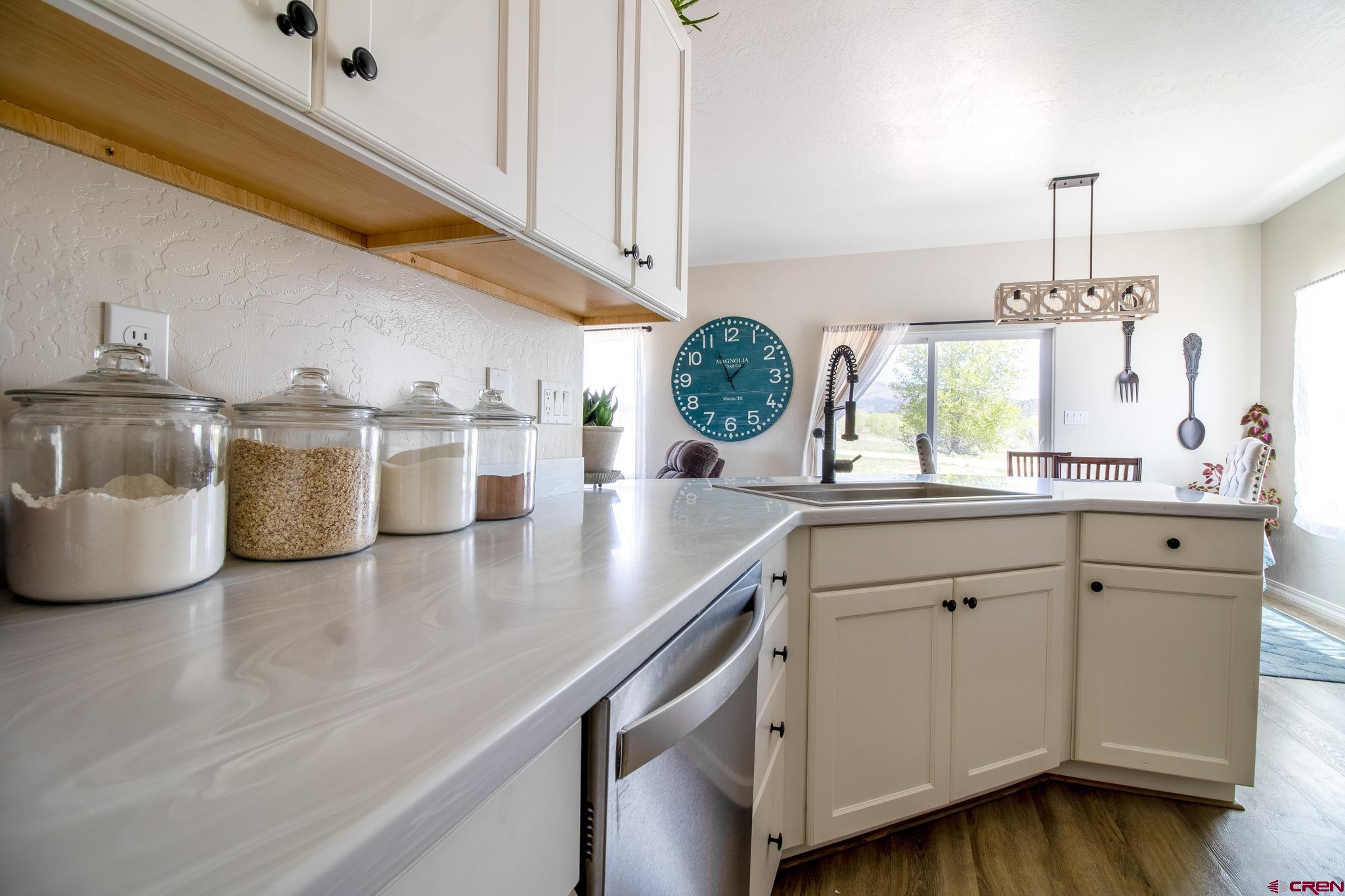 42168 Rd J Mancos, CO 81328 - Photo 10 of 30 a kitchen with a sink a stove and cabinets