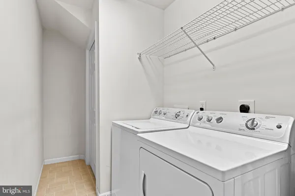 a view of a ceiling fan and a ceiling fan in a room