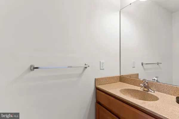 a bathroom with a sink and vanity
