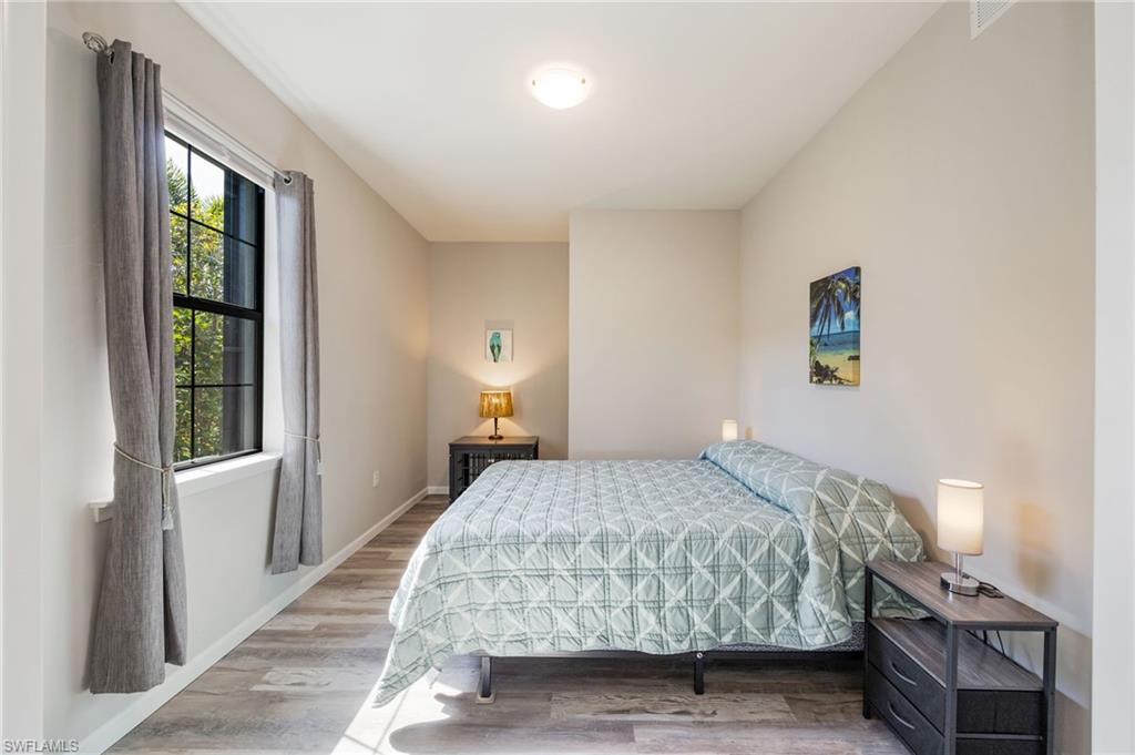 6125 Triumph Lane Ave Maria, FL 34142 - Photo 13 of 31 Bedroom with wood finished floors and baseboards