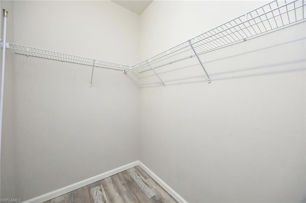 6125 Triumph Lane Ave Maria, FL 34142 - Photo 24 of 45 a view of a room with racks on the wall