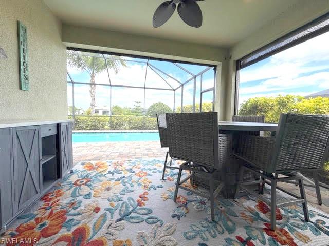 6125 Triumph Lane Ave Maria, FL 34142 - Photo 38 of 45 a view of a porch with furniture and a yard