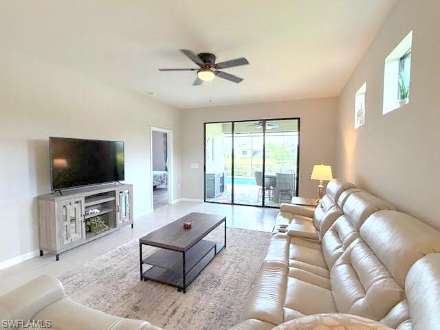 6125 Triumph Lane Ave Maria, FL 34142 - Photo 40 of 45 a living room with furniture and a flat screen tv