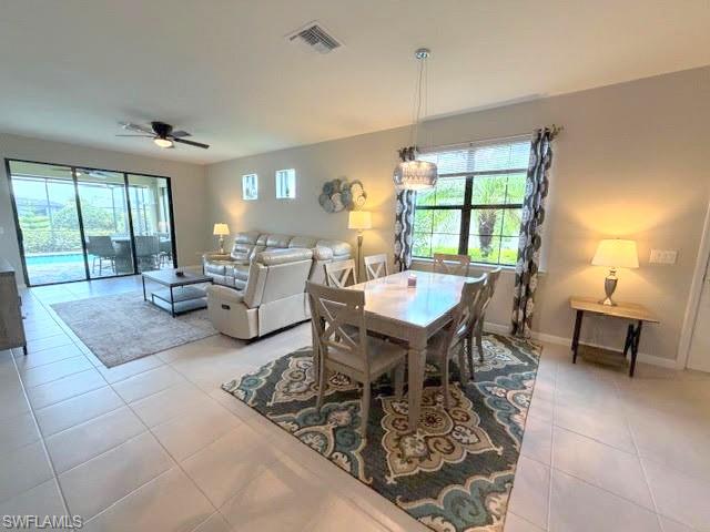6125 Triumph Lane Ave Maria, FL 34142 - Photo 41 of 45 a view of a dining room with furniture window and outside view