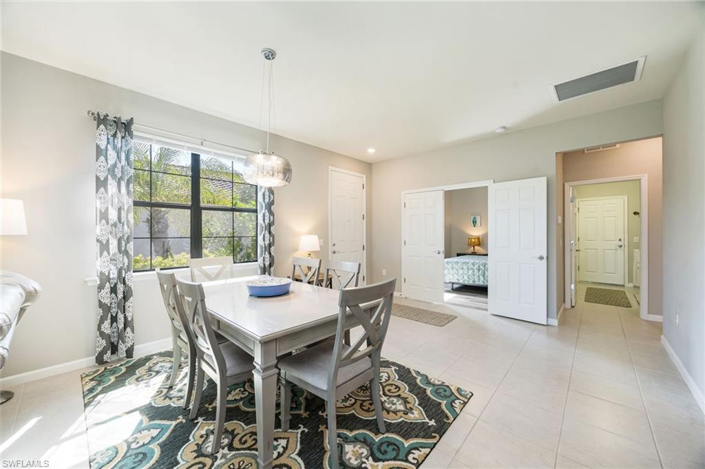 6125 Triumph Lane Ave Maria, FL 34142 - Photo 6 of 31 Dining room with light tile patterned floors and baseboards