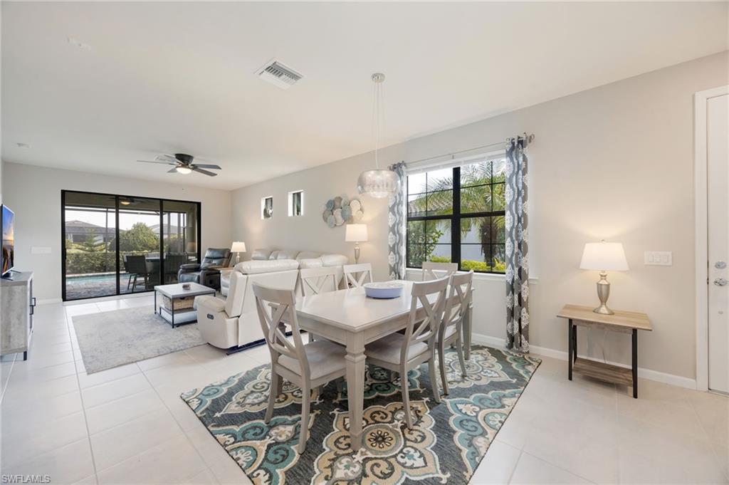 6125 Triumph Lane Ave Maria, FL 34142 - Photo 7 of 31 Dining space with ceiling fan and light tile patterned floors