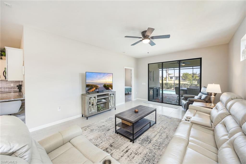 6125 Triumph Lane Ave Maria, FL 34142 - Photo 7 of 45 a living room with furniture and a flat screen tv